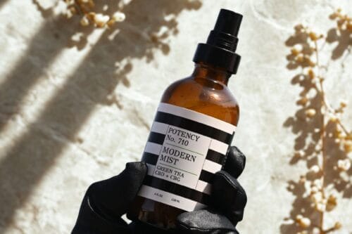 Modern Mist spray bottle with green tea, CBD, and CBG by Potency No. 710, ideal for skincare and wellness. Available at Potency No. 710.